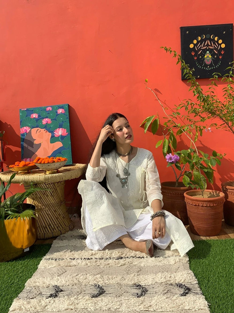 girl posing wearing a Aqsa angrakha kurta